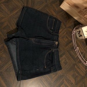Mid-high waisted denim shorts.